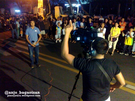 ABS-CBN's Jonathan Magistrado reports for TV Patrol outside Archbishop Palace in Naga, where Jesse Robredo's remains will be brought (Shot August 21, 2012 by Anjo Bagaoisan)